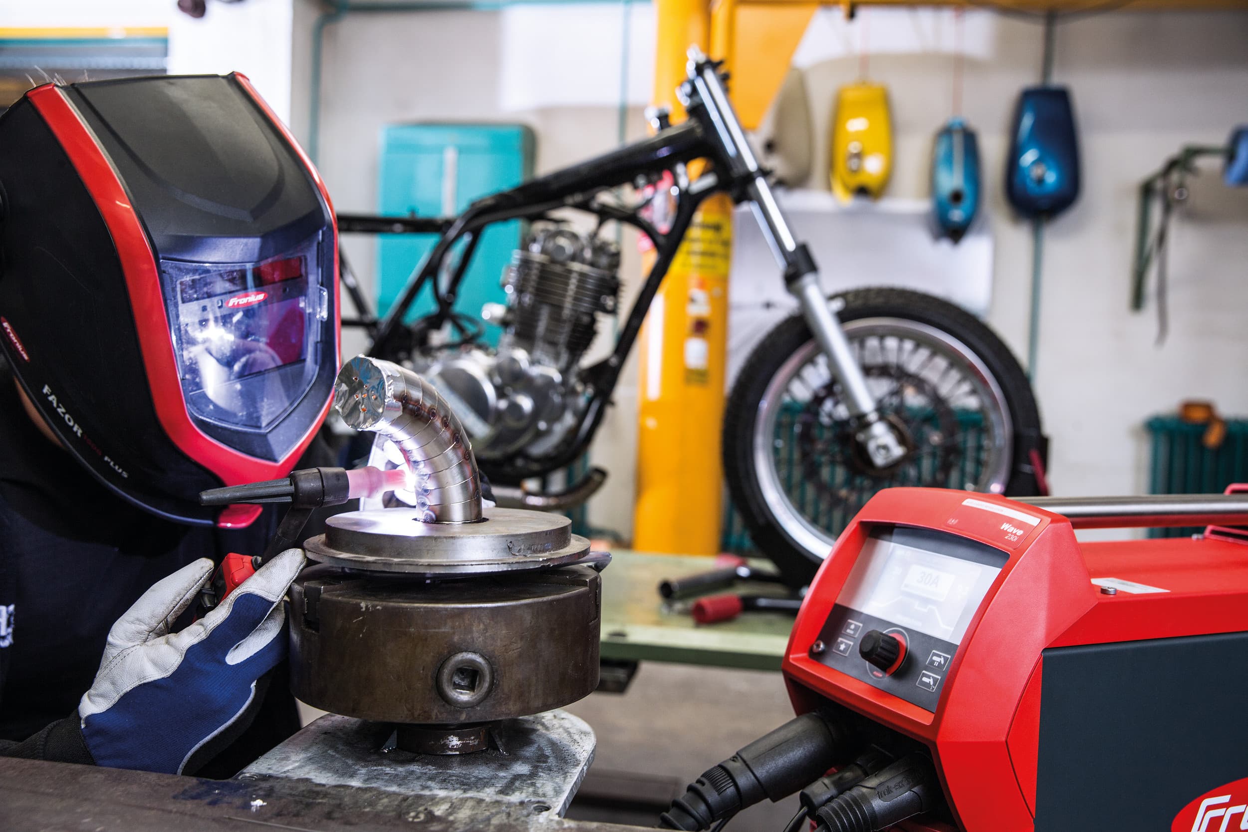 A Fronius magicwave 230i welding a stainless steel tube for a motorcycle.